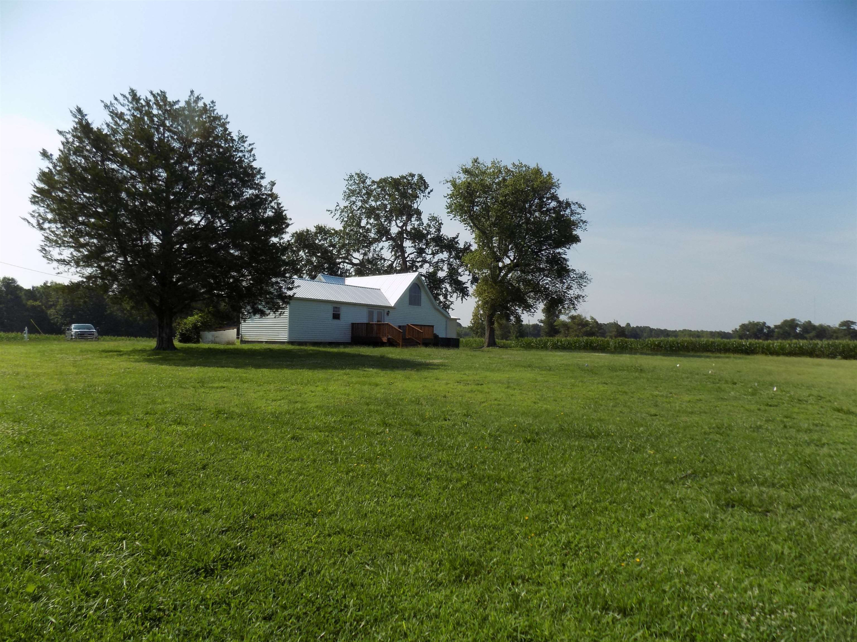 821 Greys Mill Road Louisburg, NC 27549 - Photo 7 of 33 a front view of a house with garden