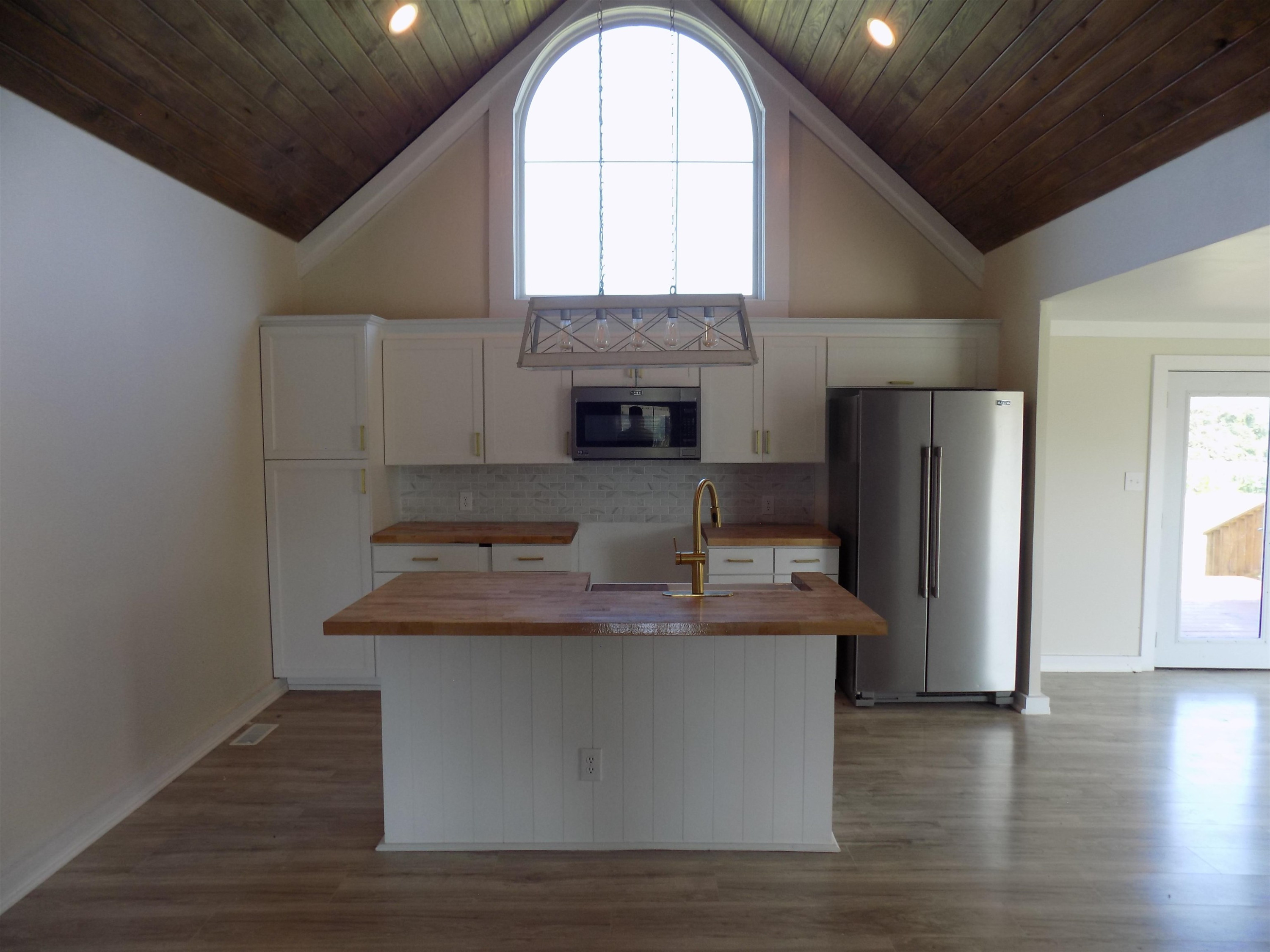 821 Greys Mill Road Louisburg, NC 27549 - Photo 10 of 33 a view of a kitchen with a sink a refrigerator and window