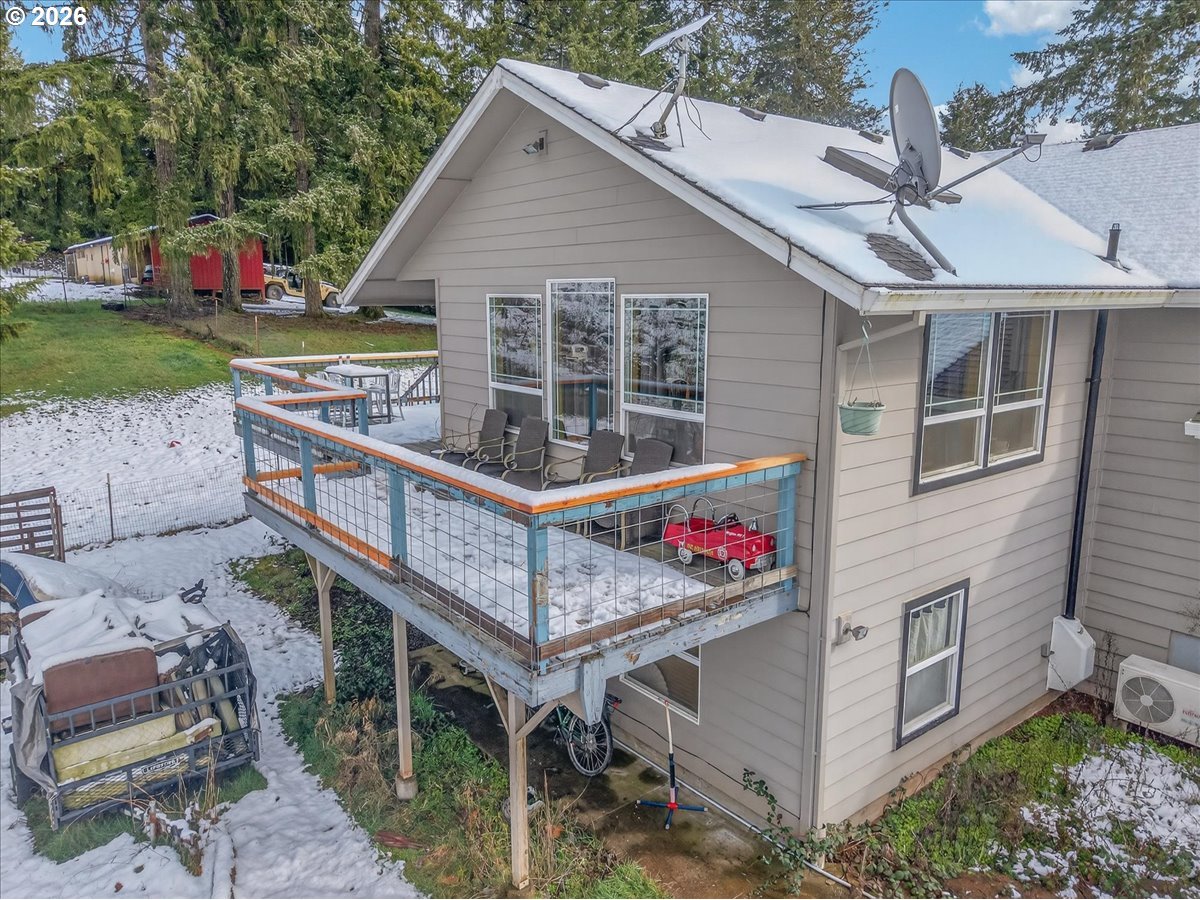 26875 Northwest Bacona Road Buxton, OR 97109 - Photo 16 of 43 a view of a house with a small yard and deck