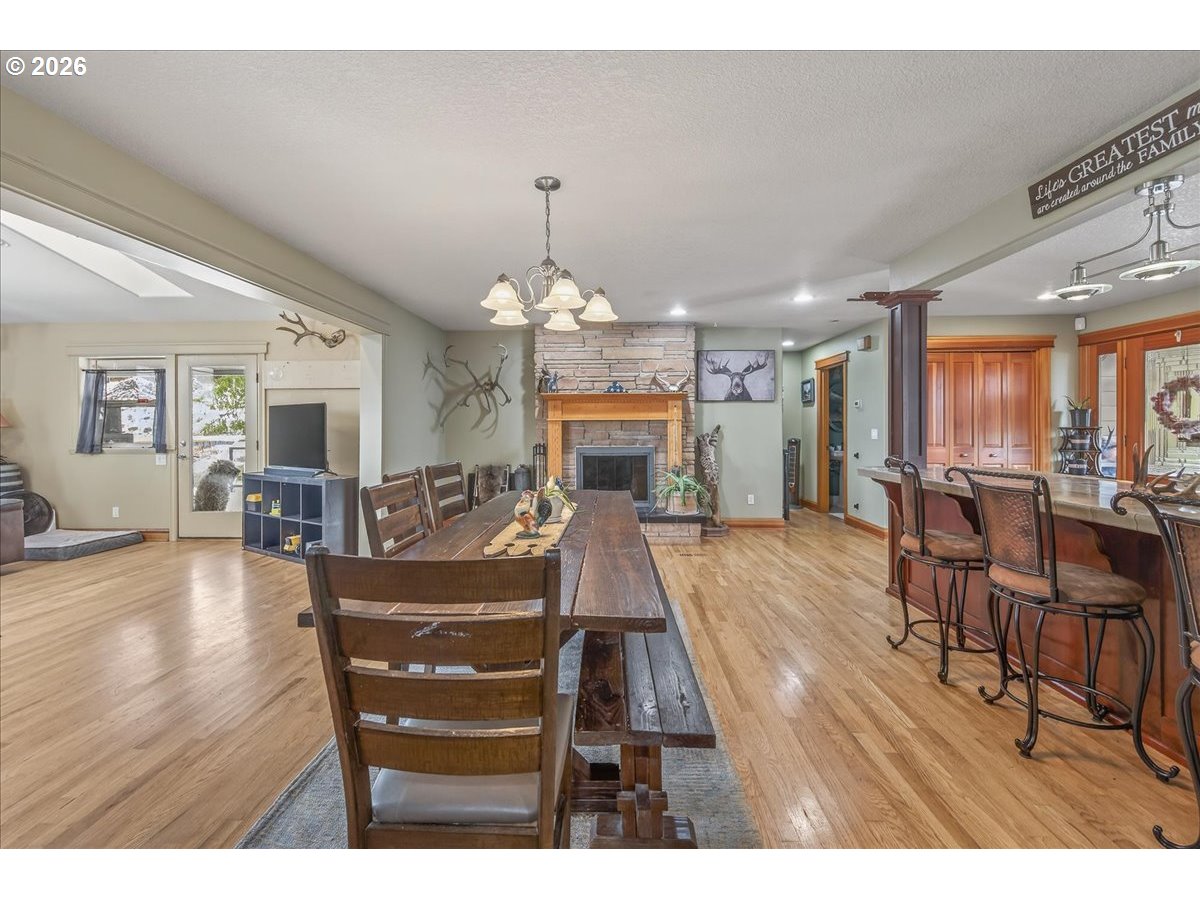26875 Northwest Bacona Road Buxton, OR 97109 - Photo 24 of 43 a view of a dining room with furniture window and wooden floor