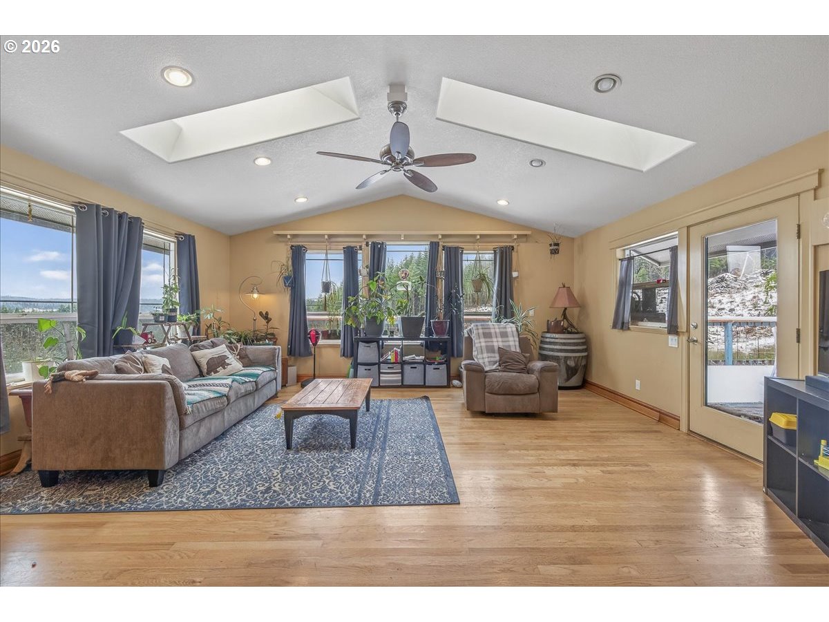 26875 Northwest Bacona Road Buxton, OR 97109 - Photo 28 of 43 a living room with furniture and a large window