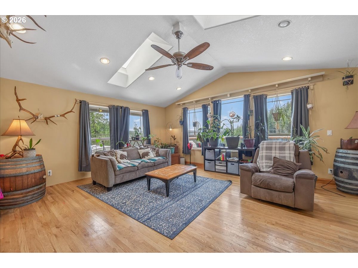 26875 Northwest Bacona Road Buxton, OR 97109 - Photo 29 of 43 a living room with furniture and a large window