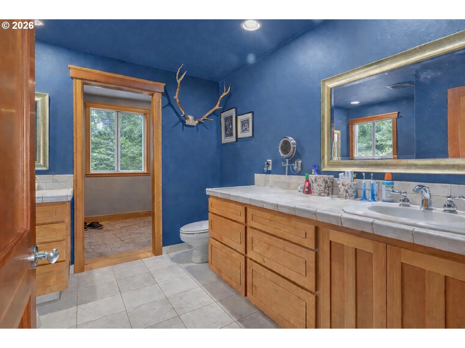 26875 Northwest Bacona Road Buxton, OR 97109 - Photo 35 of 43 a bathroom with a granite countertop sink a mirror and a bathtub