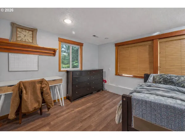 a living room with furniture flat screen tv and gym equipment