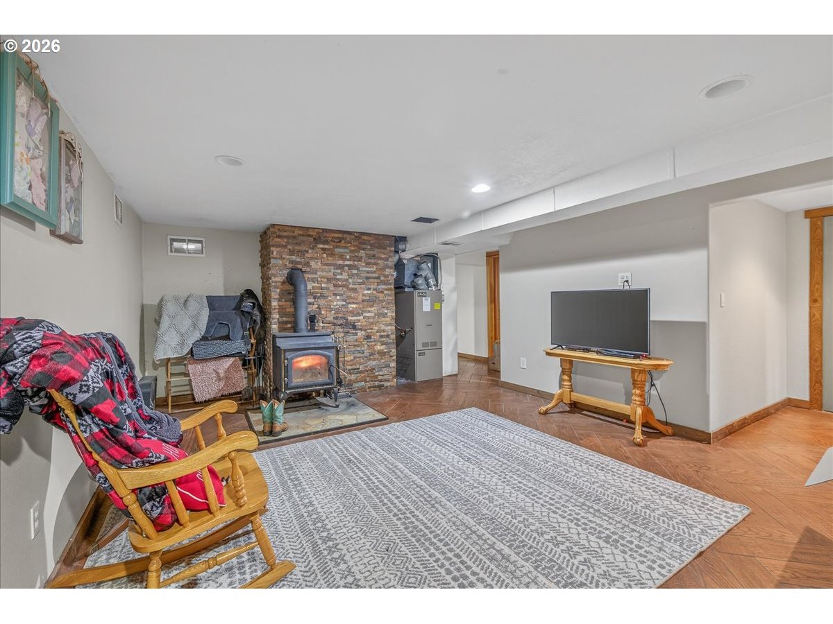 26875 Northwest Bacona Road Buxton, OR 97109 - Photo 40 of 43 a living room with furniture and a flat screen tv