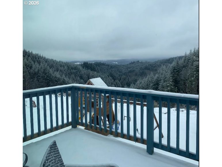 26875 Northwest Bacona Road Buxton, OR 97109 - Photo 7 of 43 a balcony with a yard