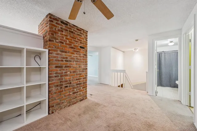 a view of an empty room with closet