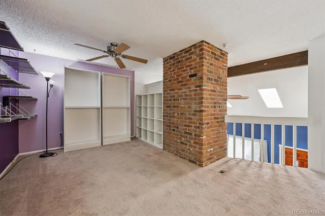 a view of an empty room with empty shelves