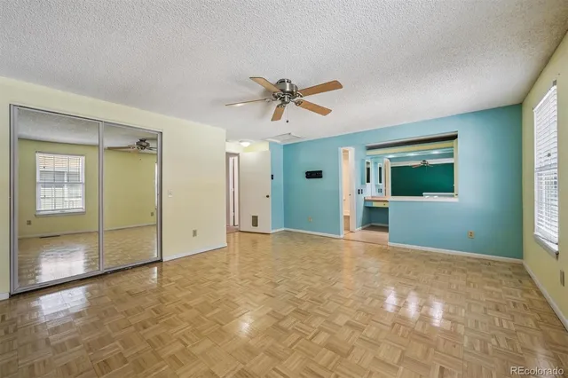 a white toilet sitting next to a bath tub