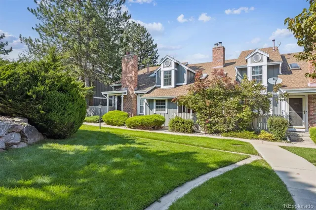 a view of a swimming pool and trees in the background