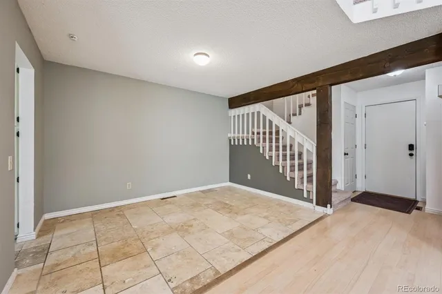 a view of an empty room with windows