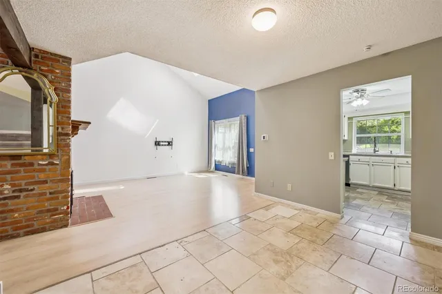 a kitchen with appliances a sink and a window