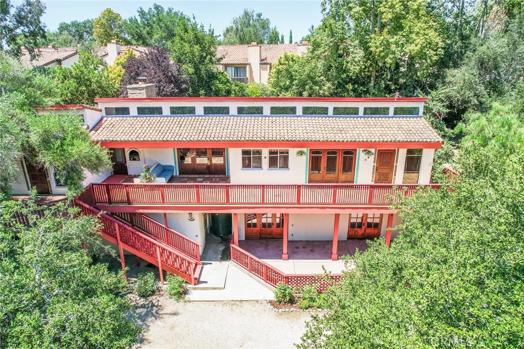 an aerial view of a house with a swimming pool
