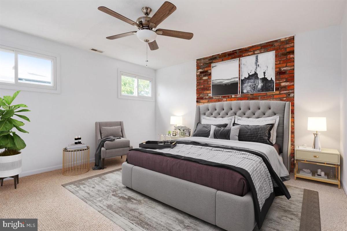 335 Tennessee Road Stevensville, MD 21666 - Photo 23 of 34 Generous Bedroom . Exposed Brick & Bombay Fan