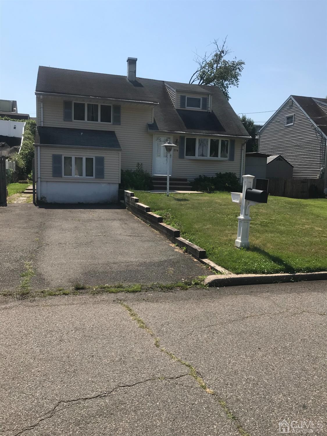 214 McFarlane Road Colonia, NJ 07067 - Photo 1 of 1 front view of a house with a yard