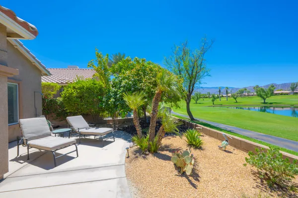 an aerial view of a house with a swimming pool yard and outdoor seating