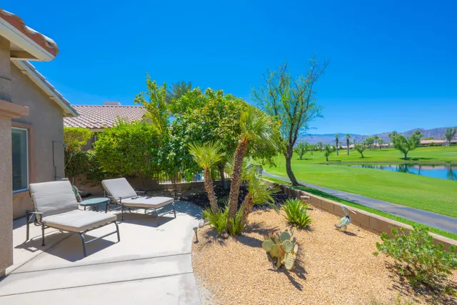 an aerial view of a house with a swimming pool yard and outdoor seating