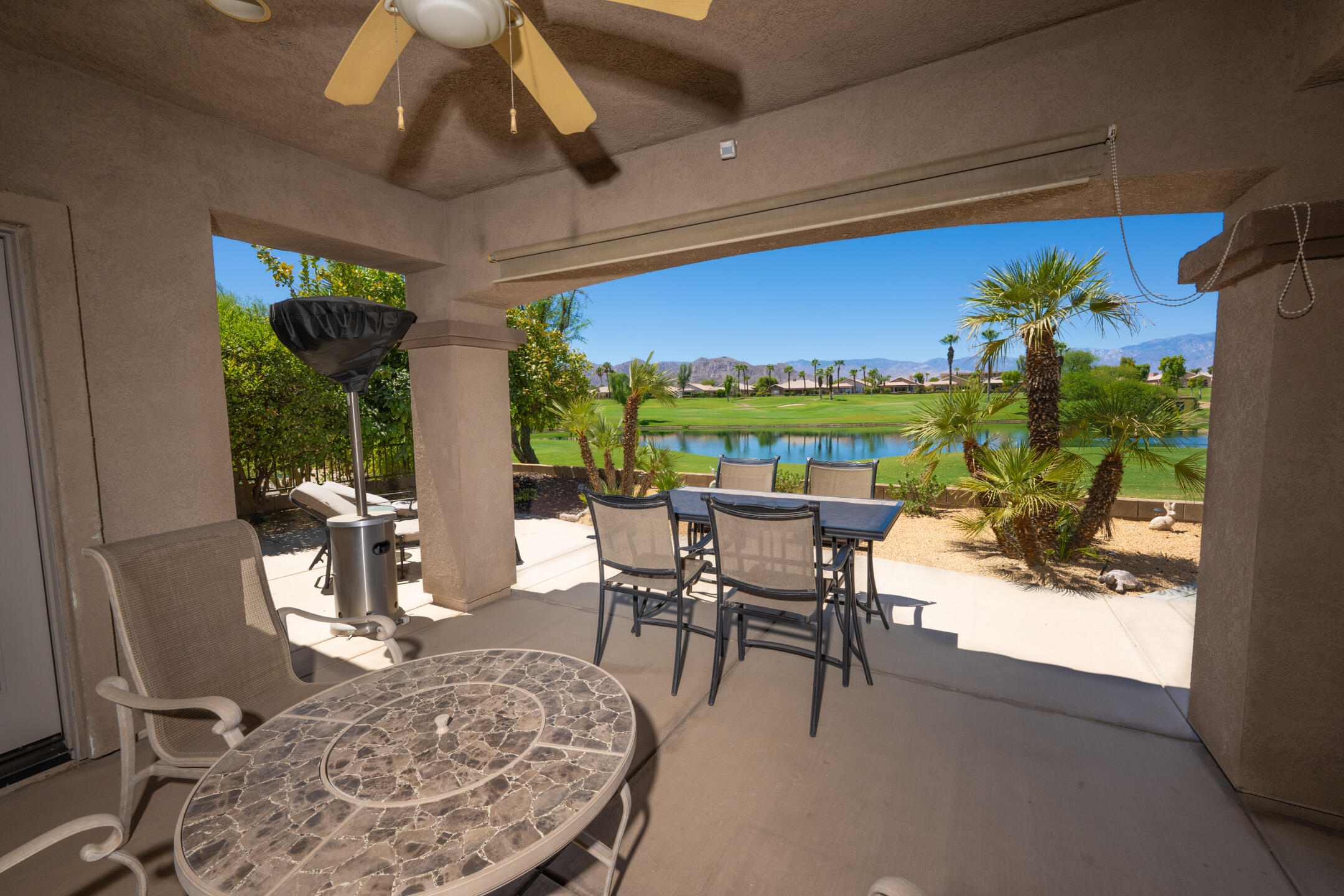 45233 Big Canyon Street Indio, CA 92201 - Photo 25 of 43 a view of a dining room with furniture window and outside view