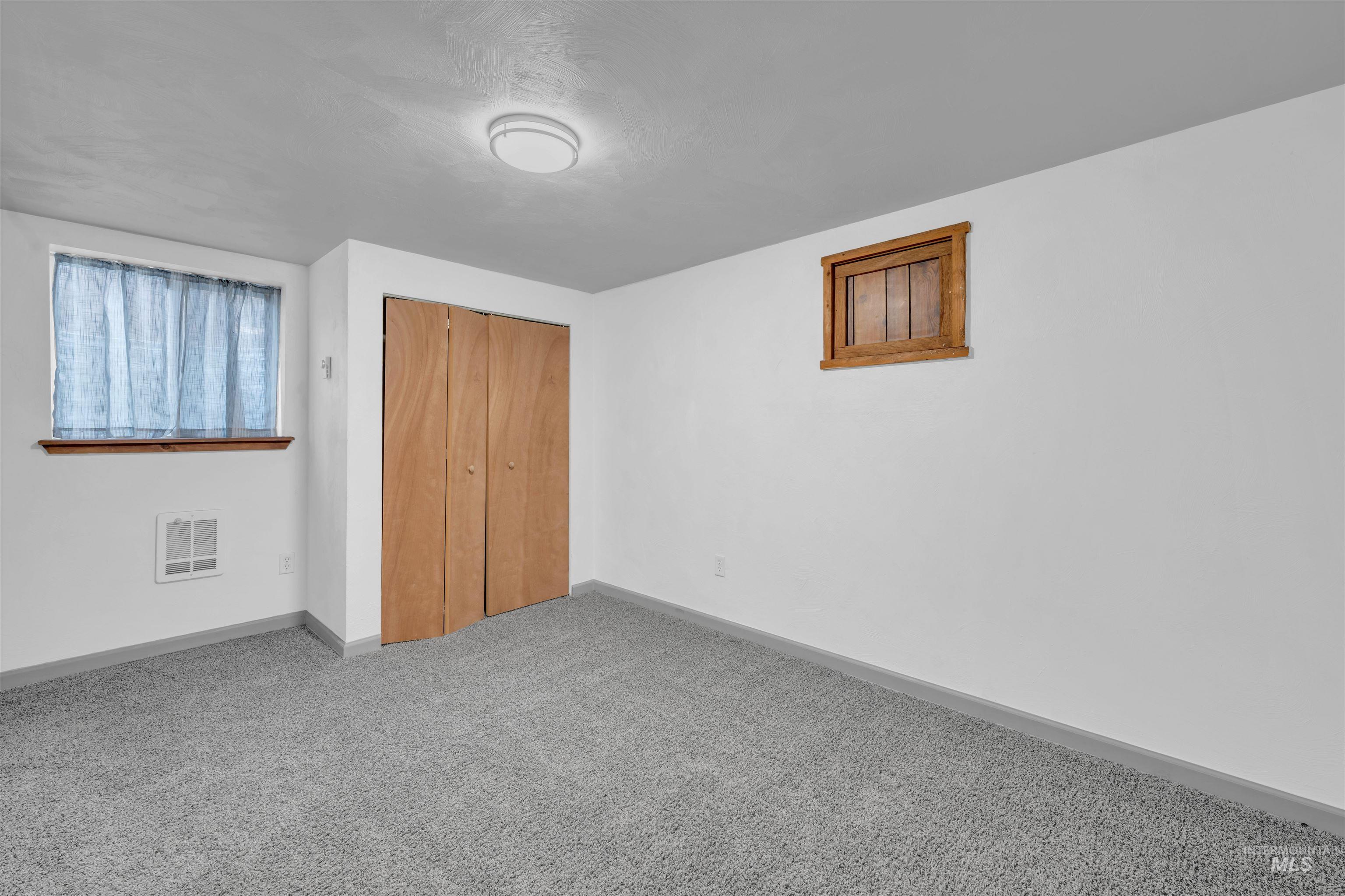 120 South Locust Street Nampa, ID 83686 - Photo 20 of 32 Unfurnished bedroom with carpet and a closet