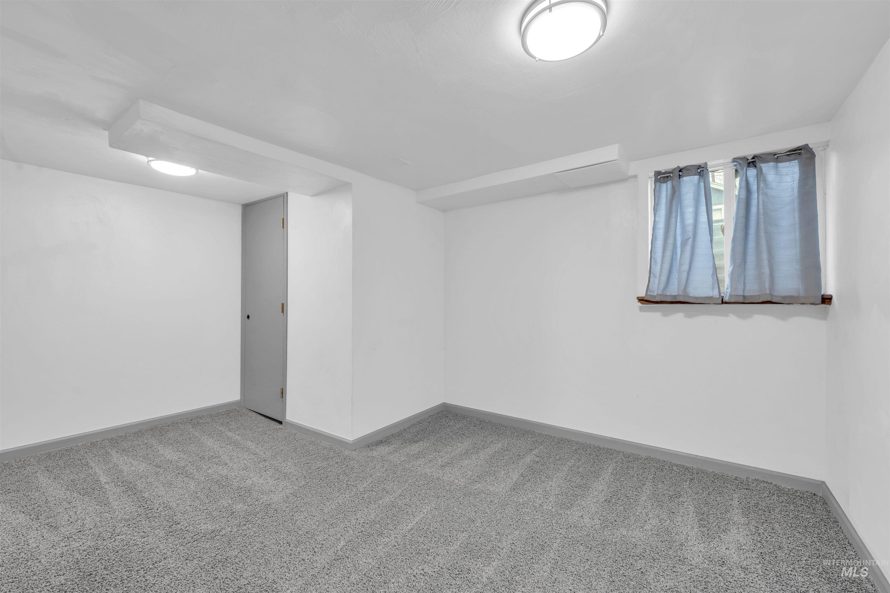 120 South Locust Street Nampa, ID 83686 - Photo 21 of 32 Empty room with carpet flooring and baseboards