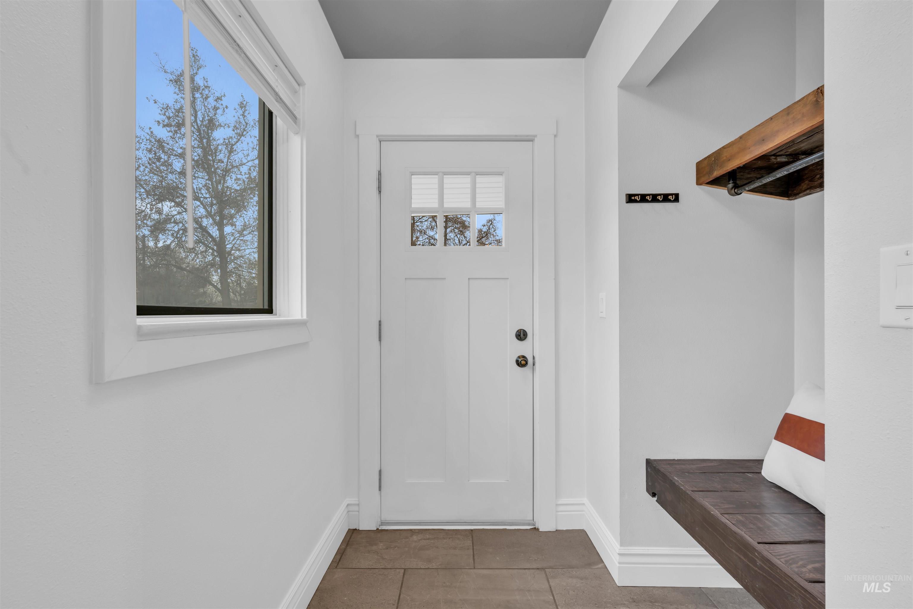 120 South Locust Street Nampa, ID 83686 - Photo 5 of 32 Mudroom with baseboards and tile patterned floors