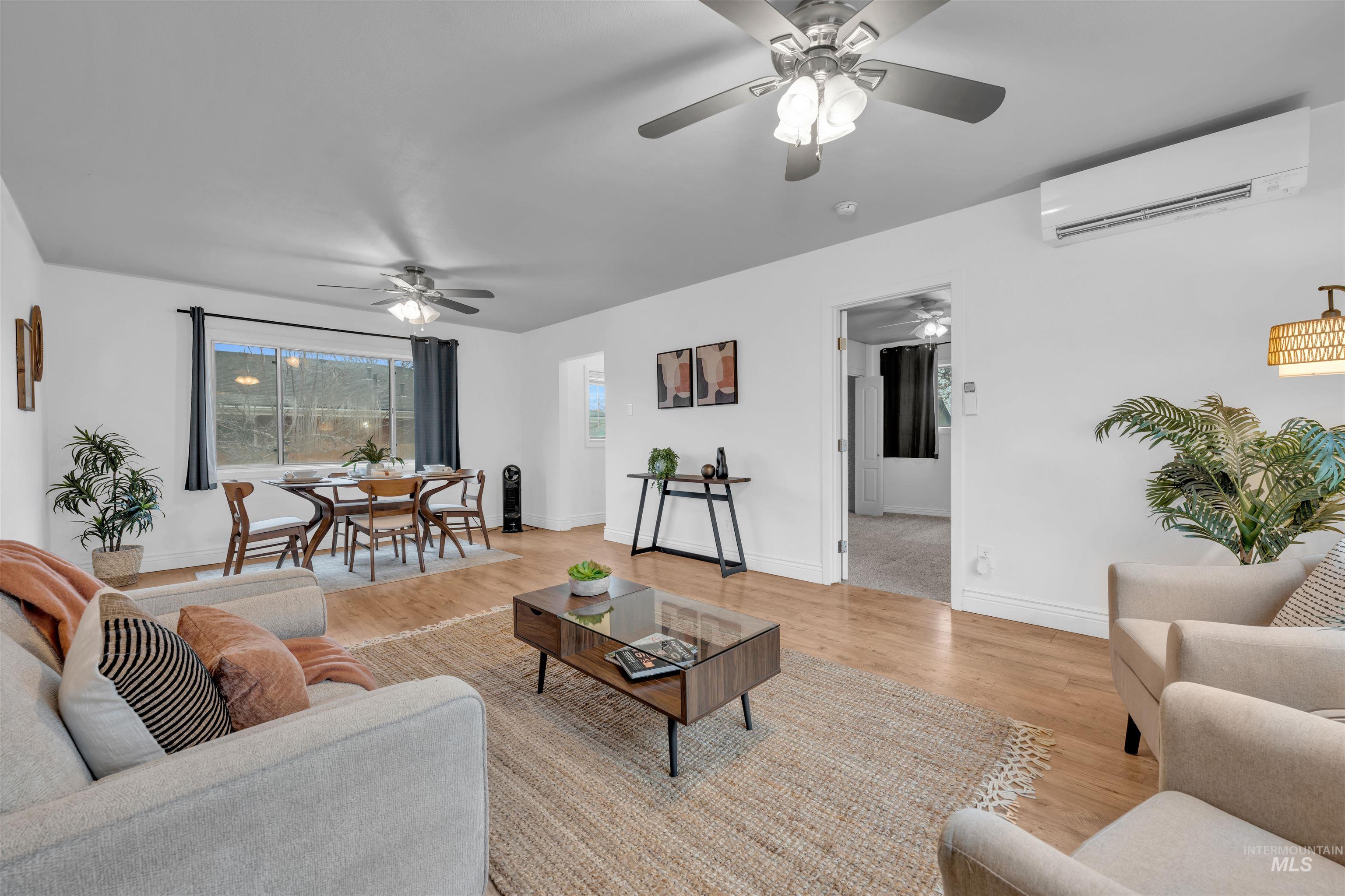 120 South Locust Street Nampa, ID 83686 - Photo 10 of 32 Living room featuring a wall mounted AC and light wood finished floors