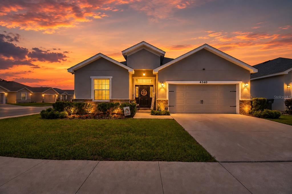 4340 Reding Way Lakeland, FL 33813 - Photo 1 of 63 a view of a big house with a big yard and potted plants