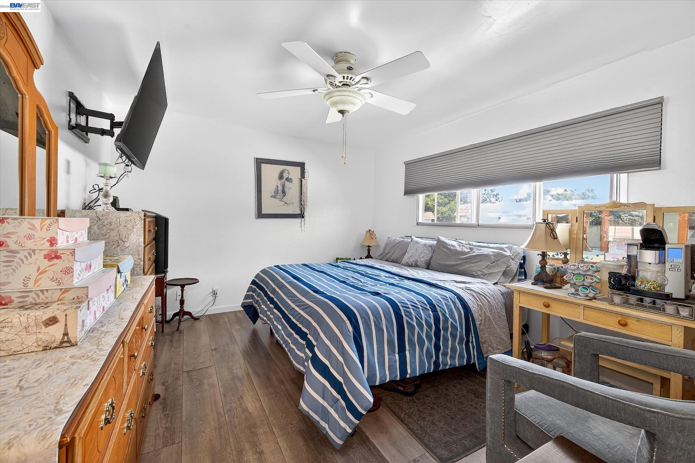 4416 Comanche Way Pleasanton, CA 94588 - Photo 15 of 24 a bedroom with a bed and wooden floor