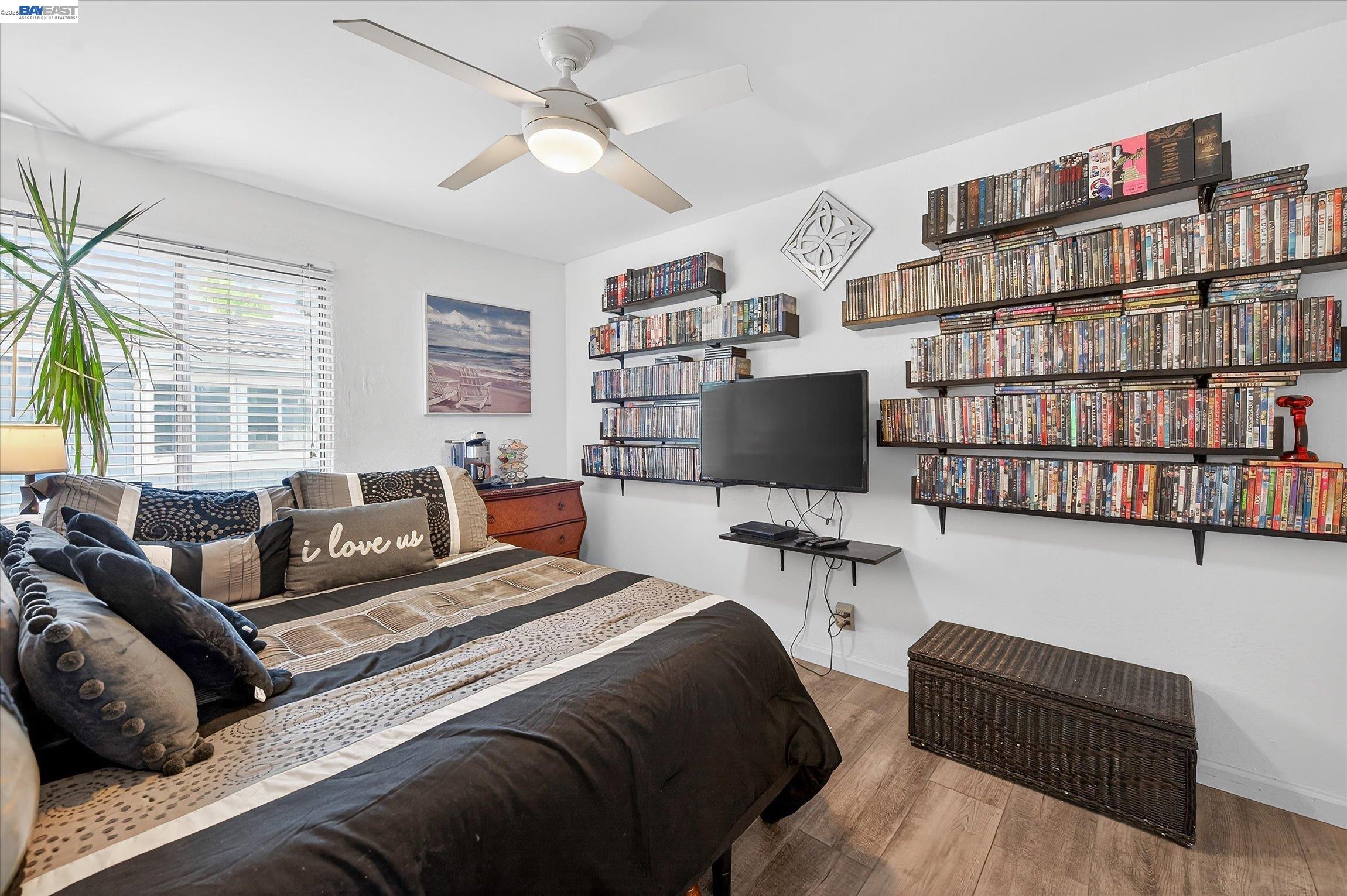 4416 Comanche Way Pleasanton, CA 94588 - Photo 16 of 24 a bedroom with furniture and a flat screen tv
