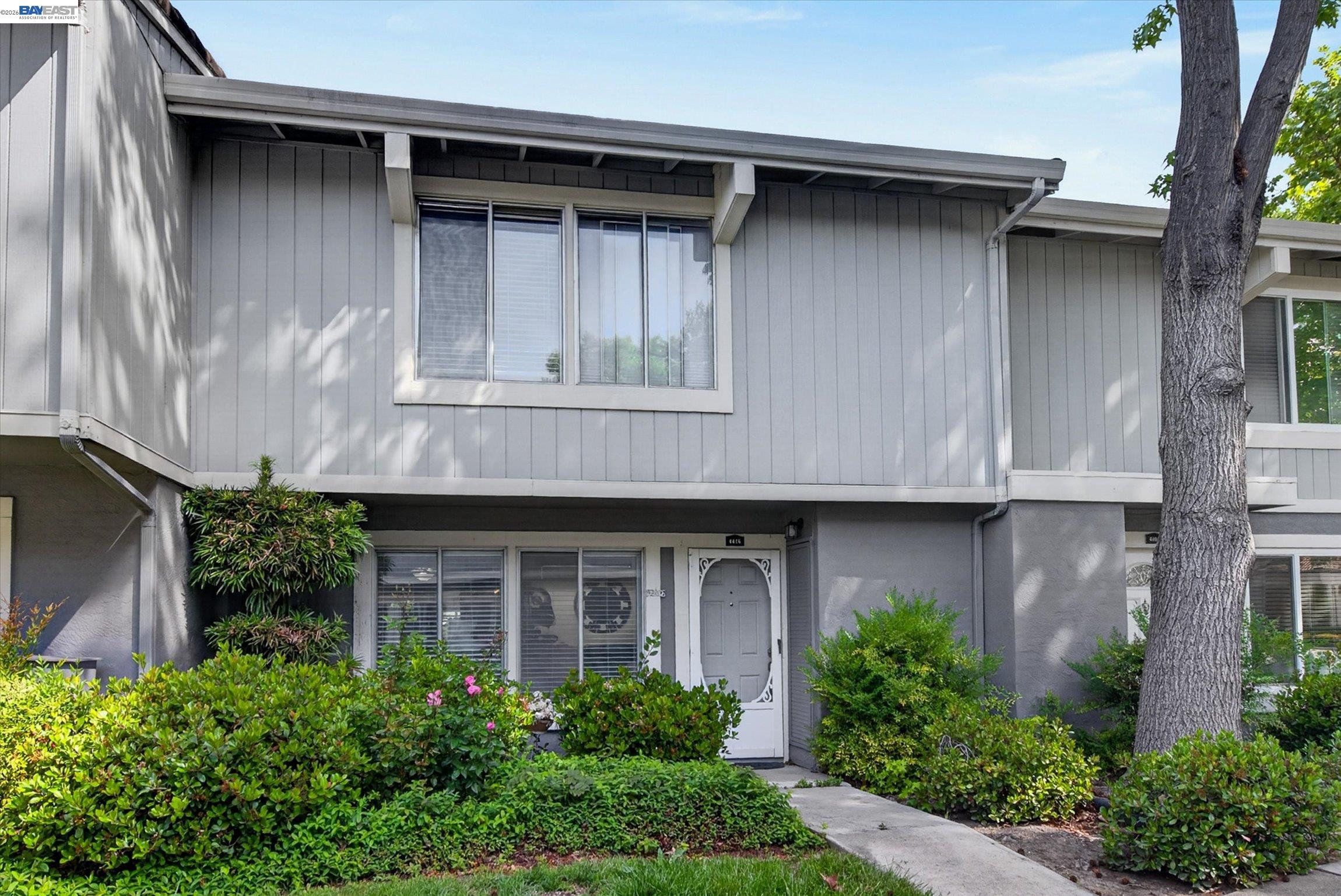 4416 Comanche Way Pleasanton, CA 94588 - Photo 2 of 24 a front view of a house with a garden