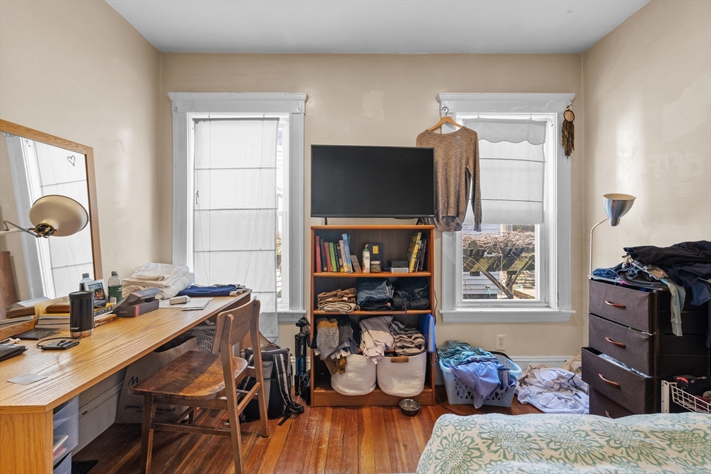 7 Simpson Avenue Somerville, MA 02144 - Photo 13 of 36 a living room with furniture and a flat screen tv