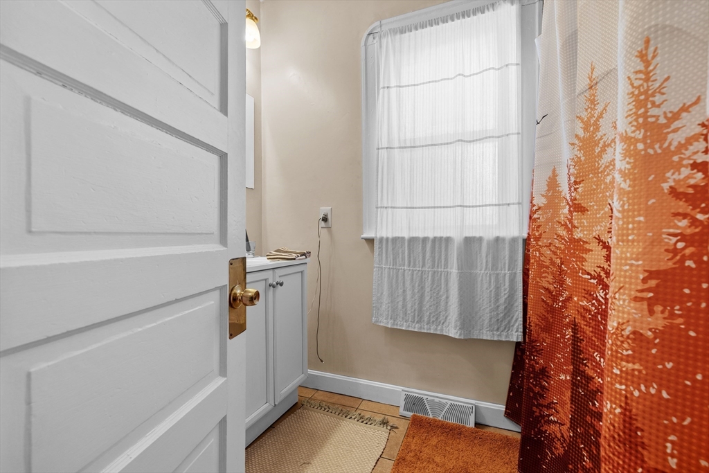 7 Simpson Avenue Somerville, MA 02144 - Photo 14 of 36 a bathroom with a tub and shower