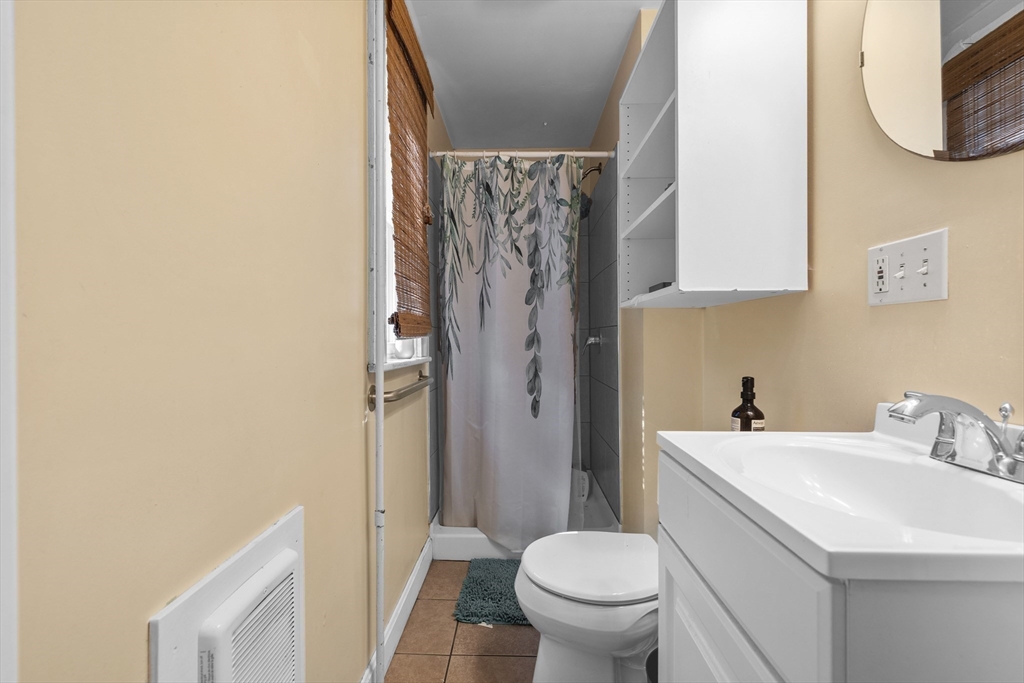 7 Simpson Avenue Somerville, MA 02144 - Photo 18 of 36 a bathroom with a sink toilet and shower