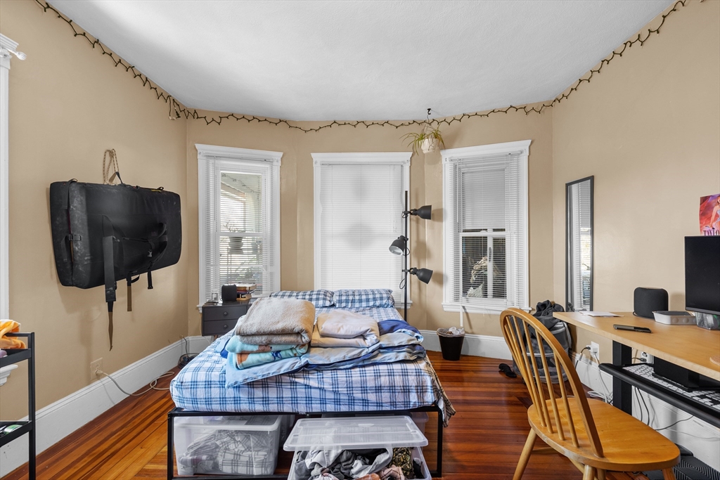 7 Simpson Avenue Somerville, MA 02144 - Photo 27 of 36 a living room with furniture and a flat screen tv