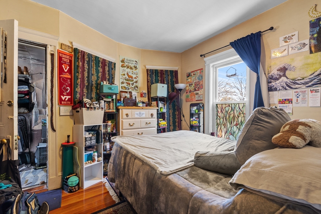 7 Simpson Avenue Somerville, MA 02144 - Photo 29 of 36 a living room with furniture and a flat screen tv