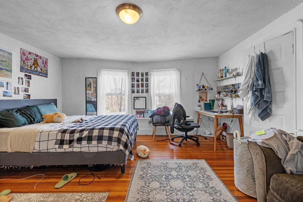 7 Simpson Avenue Somerville, MA 02144 - Photo 31 of 36 a living room with furniture and a flat screen tv