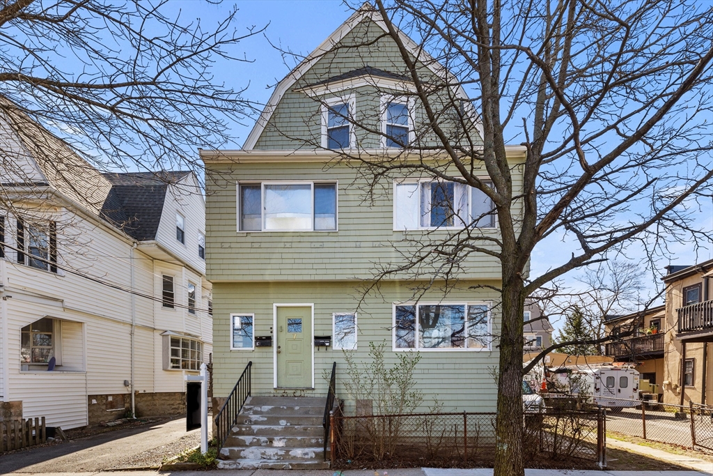 7 Simpson Avenue Somerville, MA 02144 - Photo 36 of 36 a view of a building with many windows