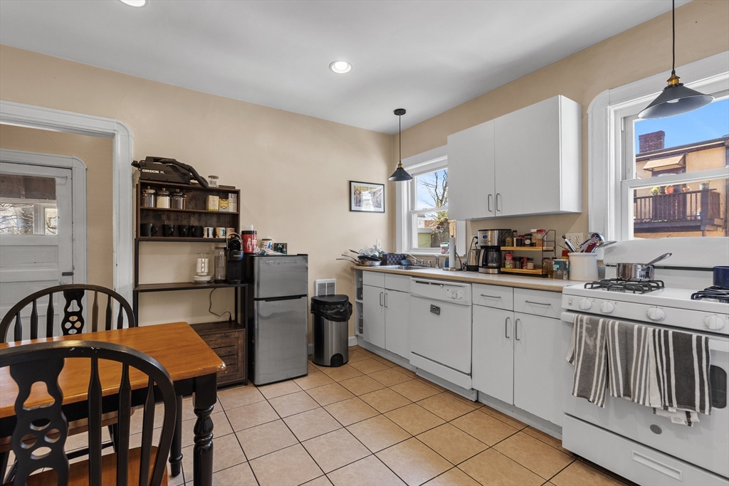 7 Simpson Avenue Somerville, MA 02144 - Photo 6 of 36 a kitchen with a refrigerator and a sink