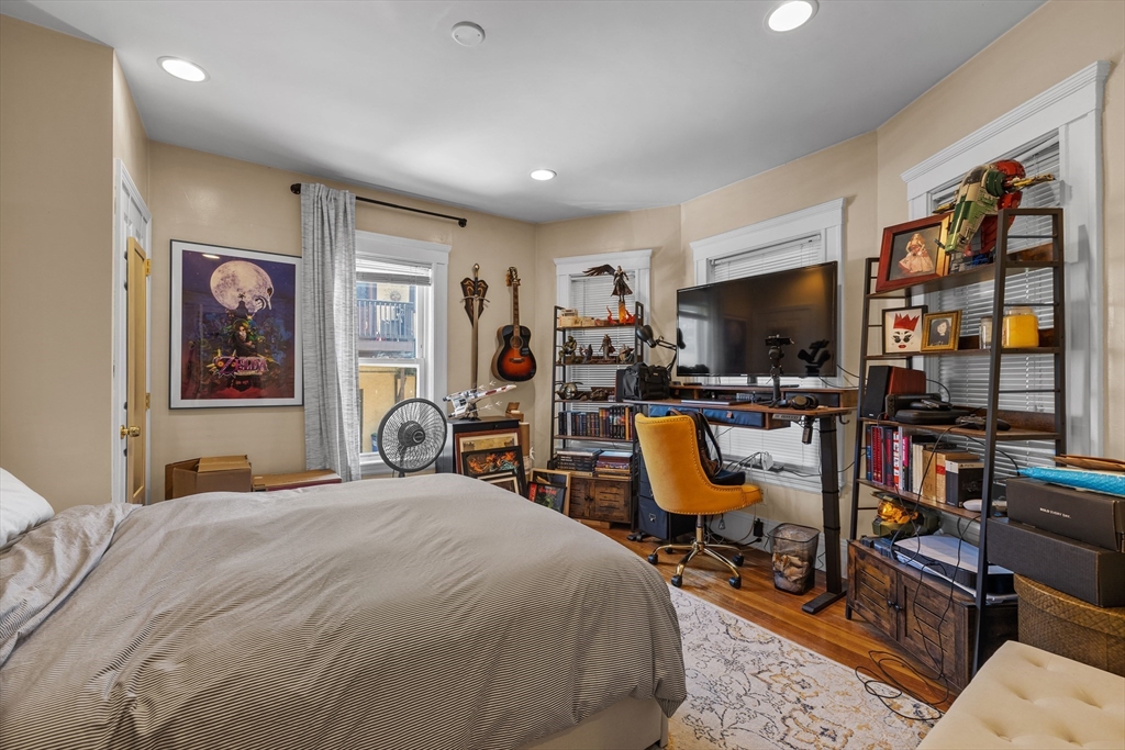 7 Simpson Avenue Somerville, MA 02144 - Photo 8 of 36 a bedroom with bed and glass door