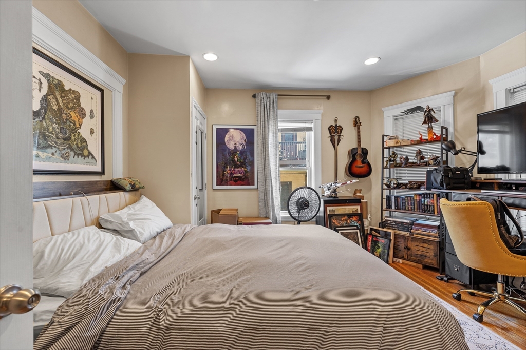 7 Simpson Avenue Somerville, MA 02144 - Photo 9 of 36 a bedroom with a bed and furniture