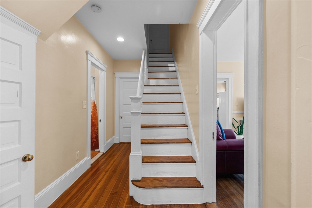 7 Simpson Avenue Somerville, MA 02144 - Photo 10 of 36 a view of entryway and hall with wooden floor