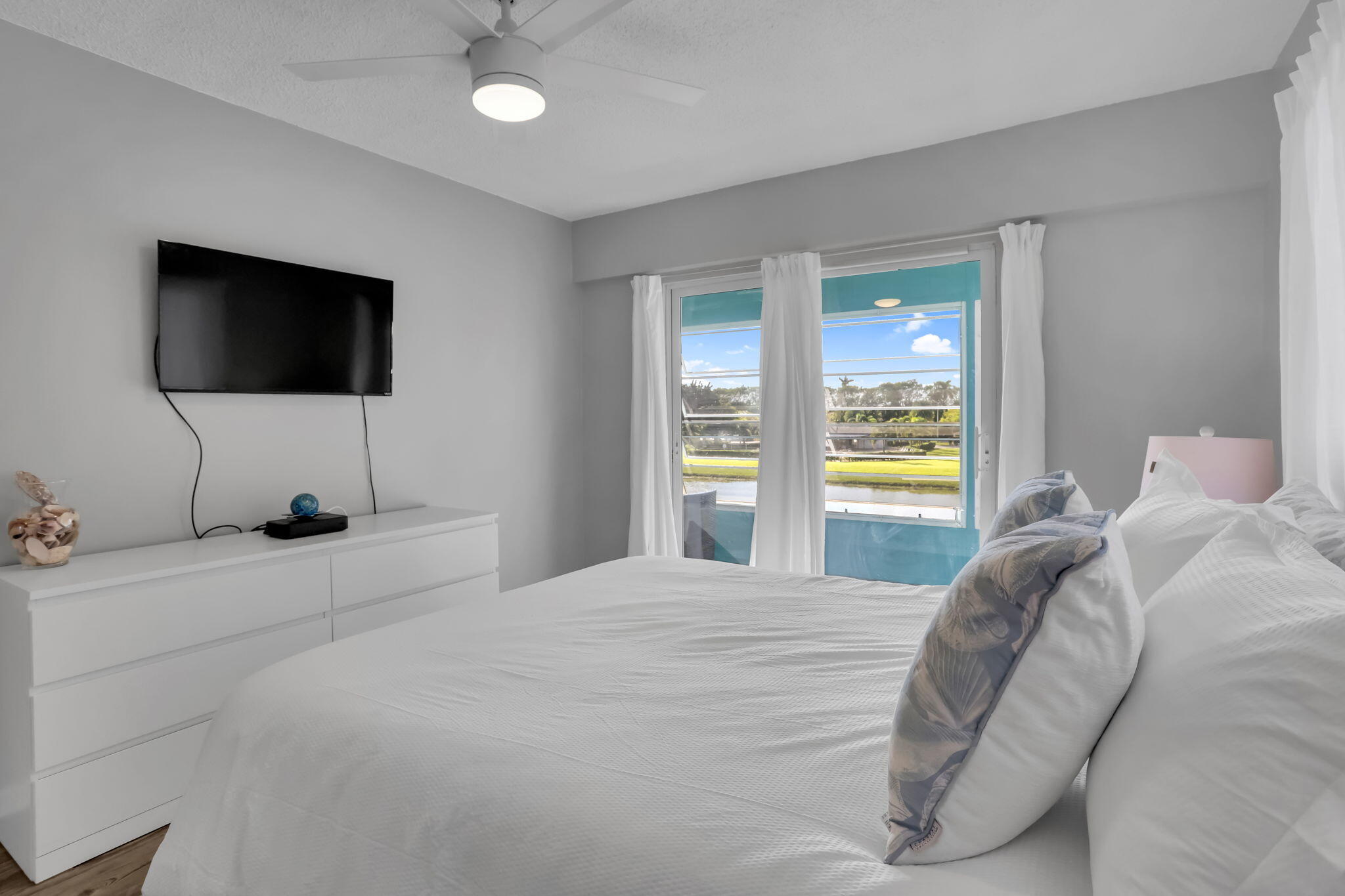336 Dorset H Boca Raton, FL 33434 - Photo 11 of 31 a bedroom with a bed and a flat screen tv