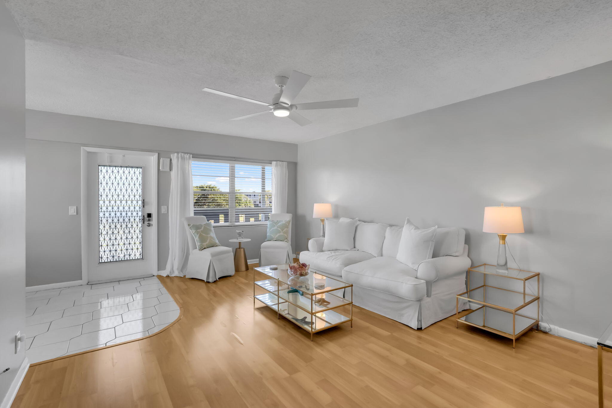 336 Dorset H Boca Raton, FL 33434 - Photo 3 of 31 a living room with furniture and a large window