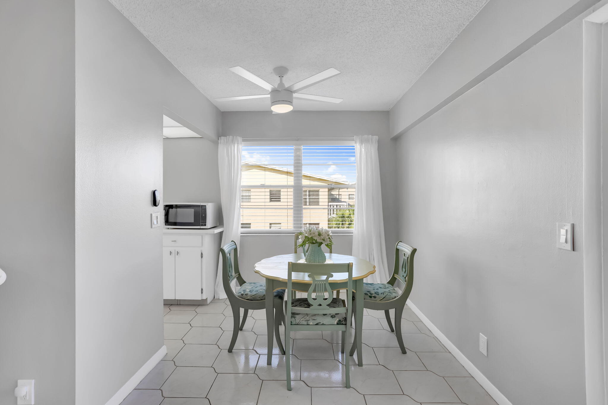 336 Dorset H Boca Raton, FL 33434 - Photo 6 of 31 a dining room with furniture and window