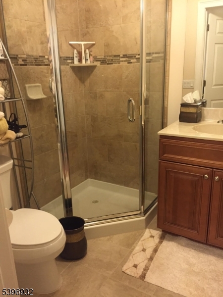 459 Main Street Metuchen, NJ 08840 - Photo 11 of 15 a bathroom with a toilet and a shower