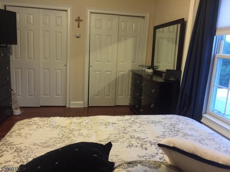 459 Main Street Metuchen, NJ 08840 - Photo 12 of 15 a bedroom with a bed and a dresser