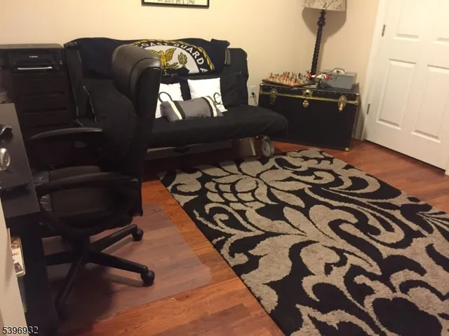 a living room with a black white checkered floor