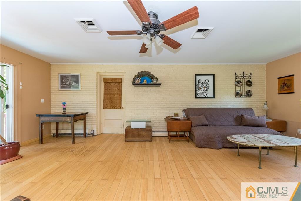 262 Bartley Road Chester, NJ 07930 - Photo 8 of 25 a living room with furniture and a table