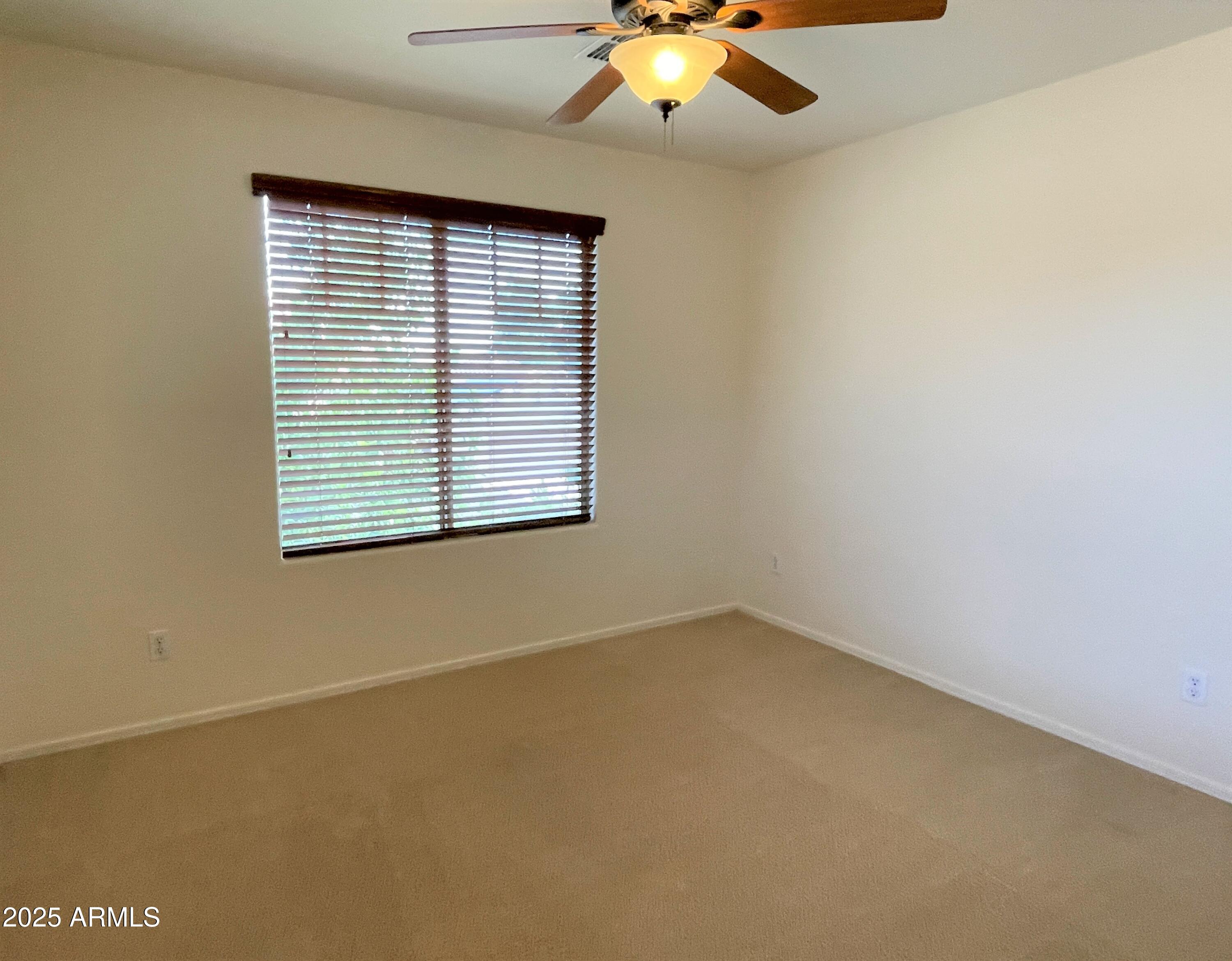 3663 East Sparrow Place Chandler, AZ 85286 - Photo 23 of 32 an empty room with a window