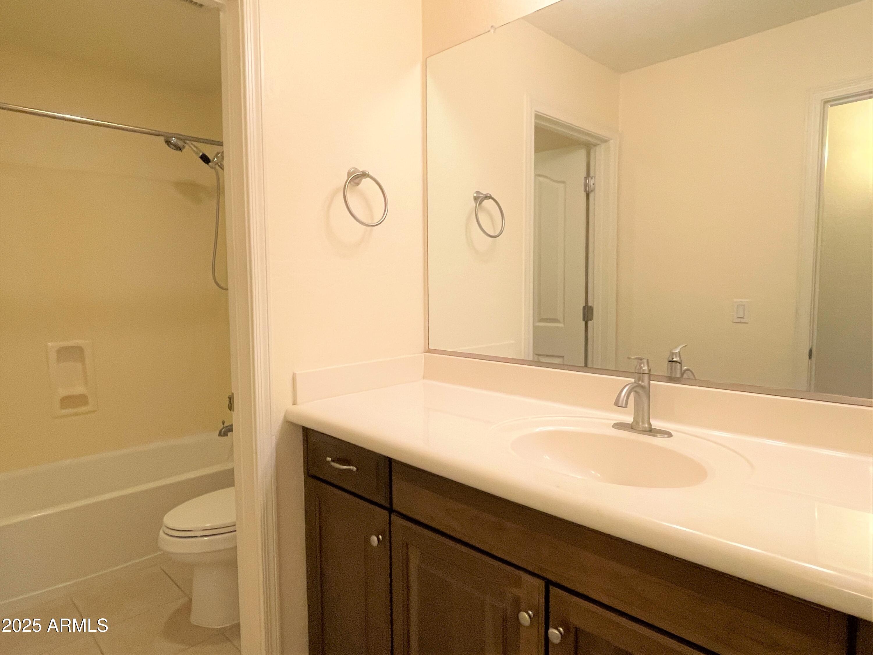 3663 East Sparrow Place Chandler, AZ 85286 - Photo 27 of 32 a bathroom with a sink a toilet and shower